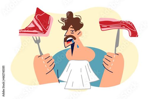Hungry man holds two steaks and fork with knife, looking forward to eating grilled pork or beef