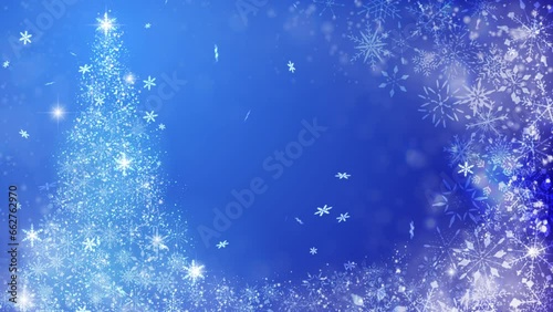 クリスマスツリーと雪の結晶が降るパーティクル、青背景