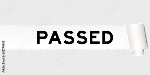 Ripped gray paper background that have word passed under torn part