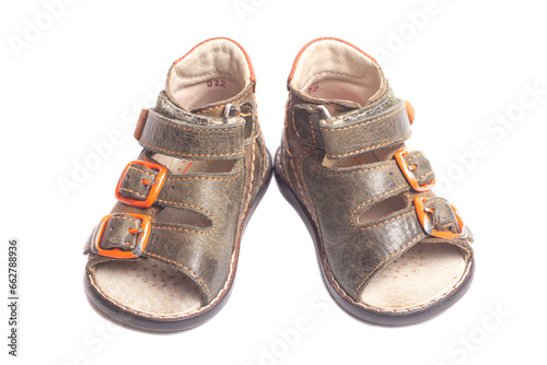 Children's leather sandals isolated on a white background.