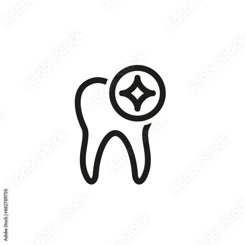 A human tooth with a glare and sparkling star.