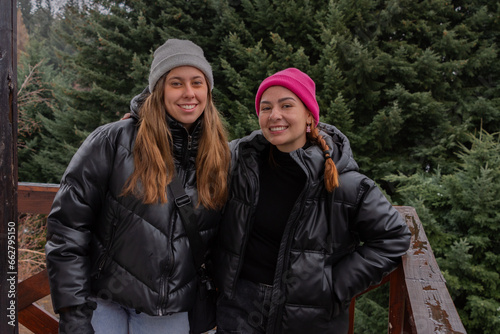 Two young women enjoying nature in winter