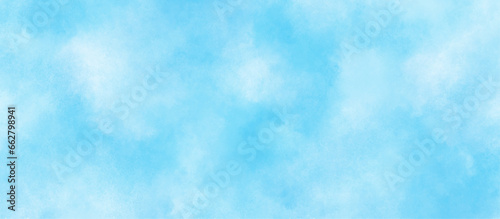  modern and fresh watercolor clouds sky background, Sky clouds with brush painted blue watercolor texture, small and large clouds alternating and moving slowly on cloudy winter morning blue sky. © MUHAMMAD TALHA