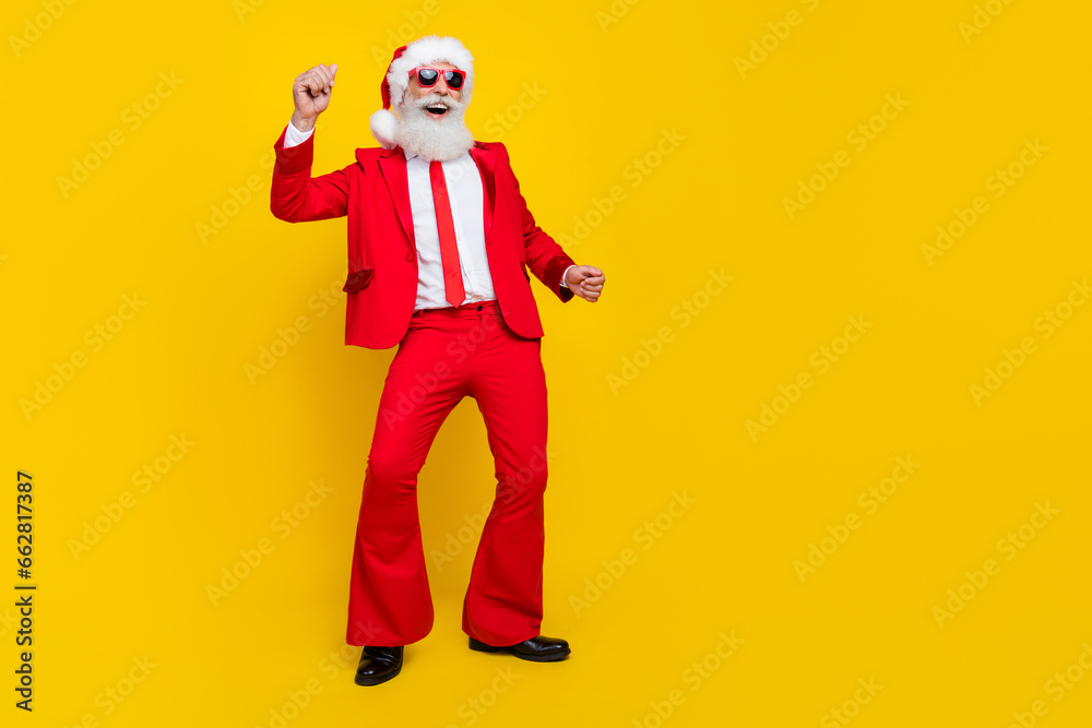 Full length photo of cheerful positive man enjoy dancing clubbing occasion isolated on yellow color background Full length photo of cheerful positive man enjoy dancing clubbing occasion isolated on yellow color background