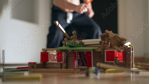 Fényképezés Child destroying house construction miniature