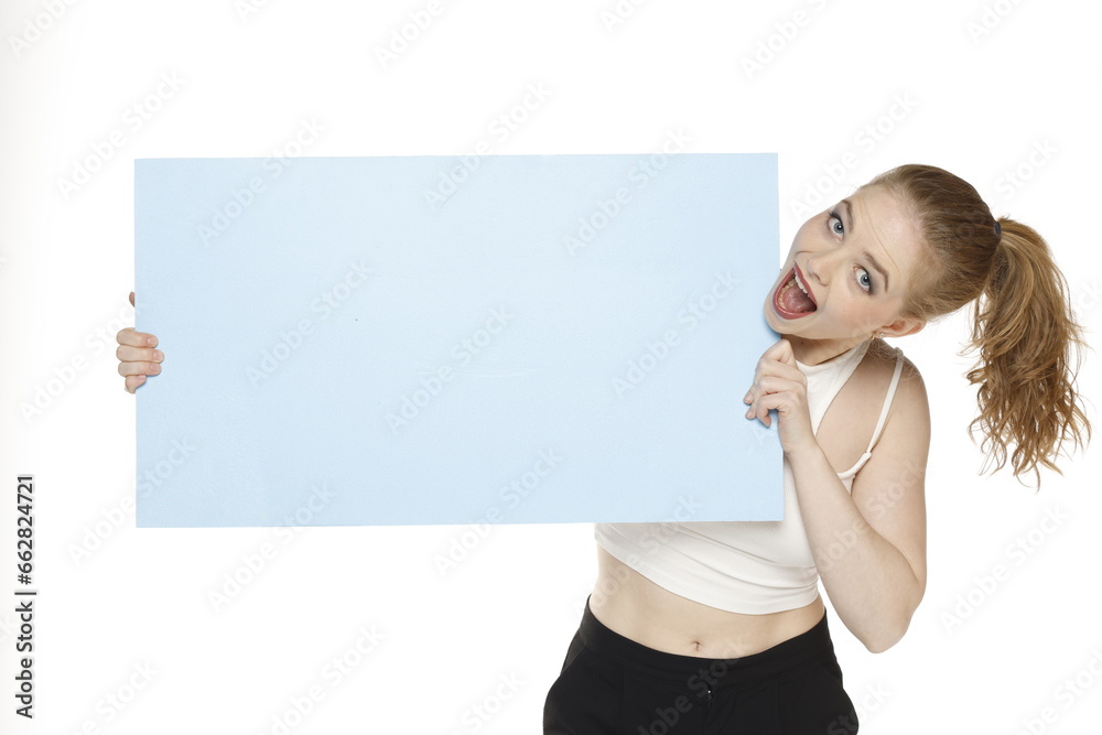 Banner of young happy blonde woman feeling happiness and holding blue Empty white canvas frame for text or advertising isolated on white background Banner of young happy blonde woman feeling happiness and holding blue Empty white canvas frame for text or advertising isolated on white background