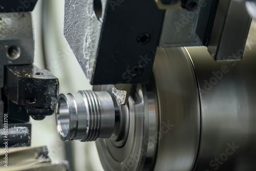 The multi-tasking CNC lathe machine swiss type finish cut the metal pipe parts.