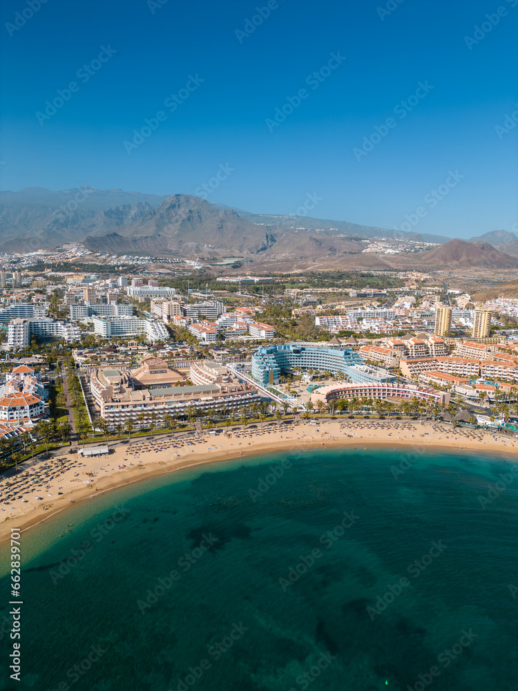 ocean shore with hotels and beach, Los Cristianos, Tenerife, Canary, aerial shot