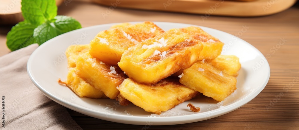 Fried banana with cheese on a plate With copyspace for text