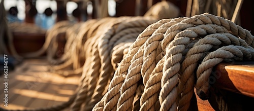 A group of ropes on a ship s deck needing skilled crew to set sail With copyspace for text