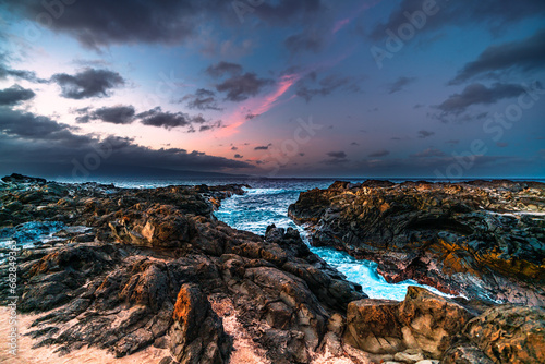  Tranquil sunset over a tropical beach of Maui island in Hawaii, United States 