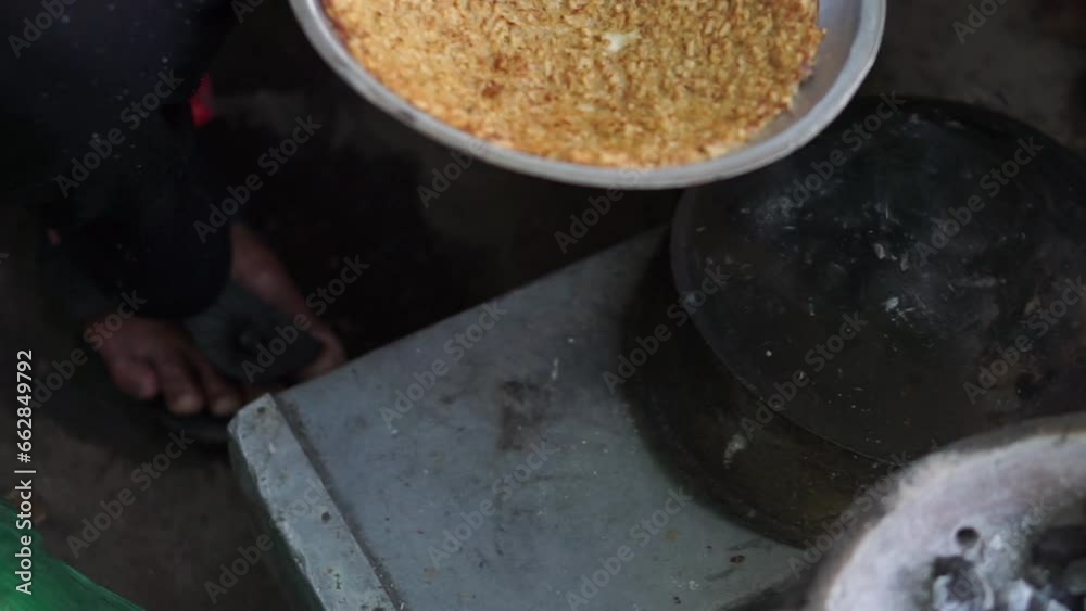 The seller cooks egg crust, egg crust in a small pan with a charcoal stove. Typical Betawi food. Surakarta, Indonesia The seller cooks egg crust, egg crust in a small pan with a charcoal stove. Typical Betawi food. Surakarta, Indonesia