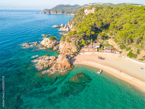 Fenals, Lloret de Mar Aerial view with Drone from the beach, Blue, turquoise, dense water, green vegetation, Mediterranean, transparent, nature, European quality tourism