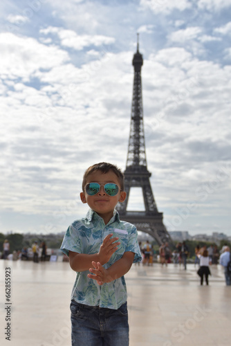 Kid traveling,on Eiffel Tower