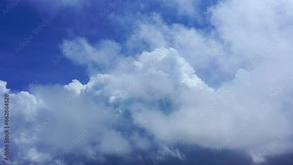 .Natural daylight and white clouds floating on blue sky..aerial panorama view white clouds in the blue sky background..light through the large white clouds float in the blue sky .Natural daylight and white clouds floating on blue sky..aerial panorama view white clouds in the blue sky background..light through the large white clouds float in the blue sky