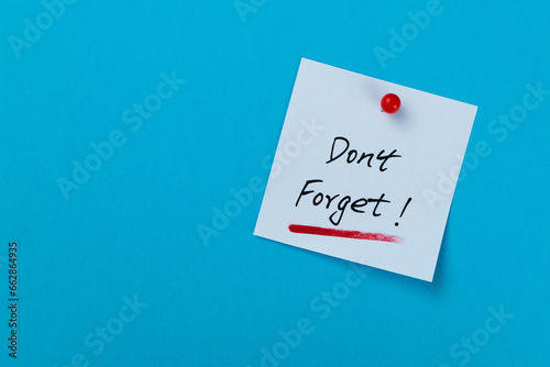 Don't forget sticky note on blue background