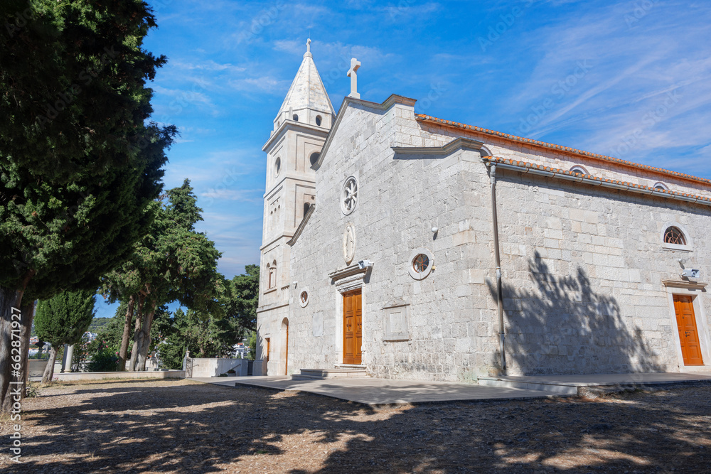 Fototapeta premium St. George's Church made of white limestone in Primosten, Croatia.