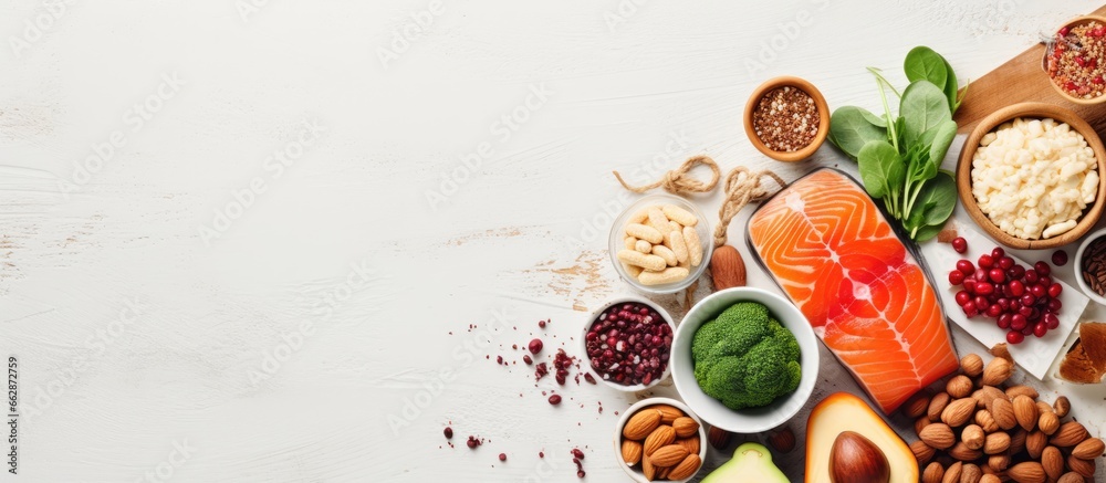 High protein foods including legumes meat fish dairy nuts tofu seeds grains and supplement powders Foods rich in fiber antioxidants and vitamins Viewed from above on white wood With copyspa - obrazy, fototapety, plakaty 