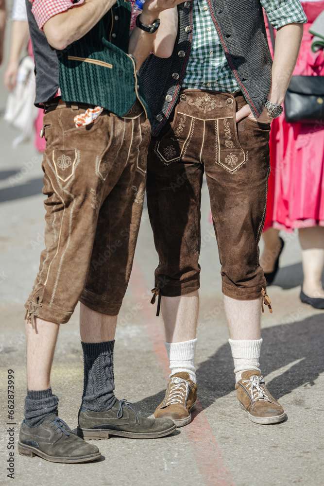 Man wearing the traditional Bavarian Lederhosen at the Oktoberfest in Munich close-up Man wearing the traditional Bavarian Lederhosen at the Oktoberfest in Munich close-up