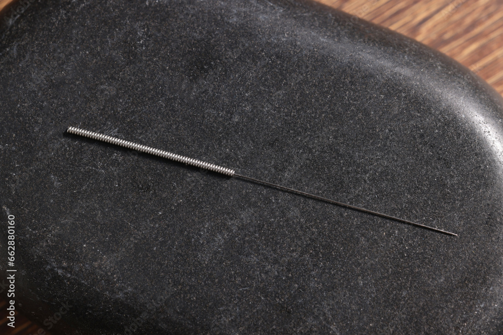 Stone coaster with acupuncture needle, top view