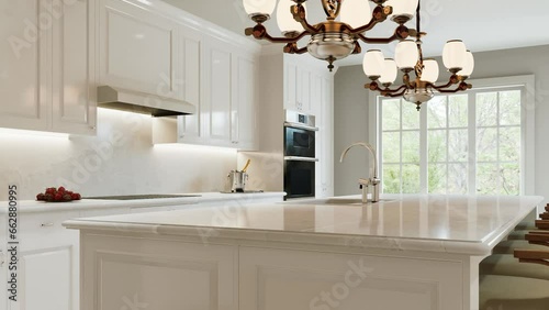 Traditional white kitchen with long island and wooden chairs with varnished wood flooring. 