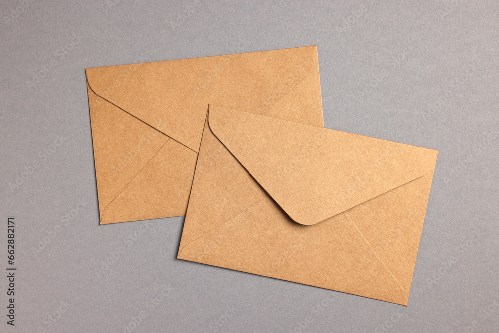 Envelopes made of parchment paper on grey background, flat lay Envelopes made of parchment paper on grey background, flat lay