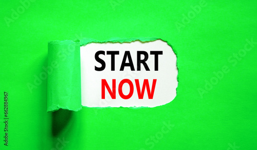 Start now symbol. Concept words Start now on beautiful white paper. Beautiful green table green background. Business marketing, motivational start now concept. Copy space.