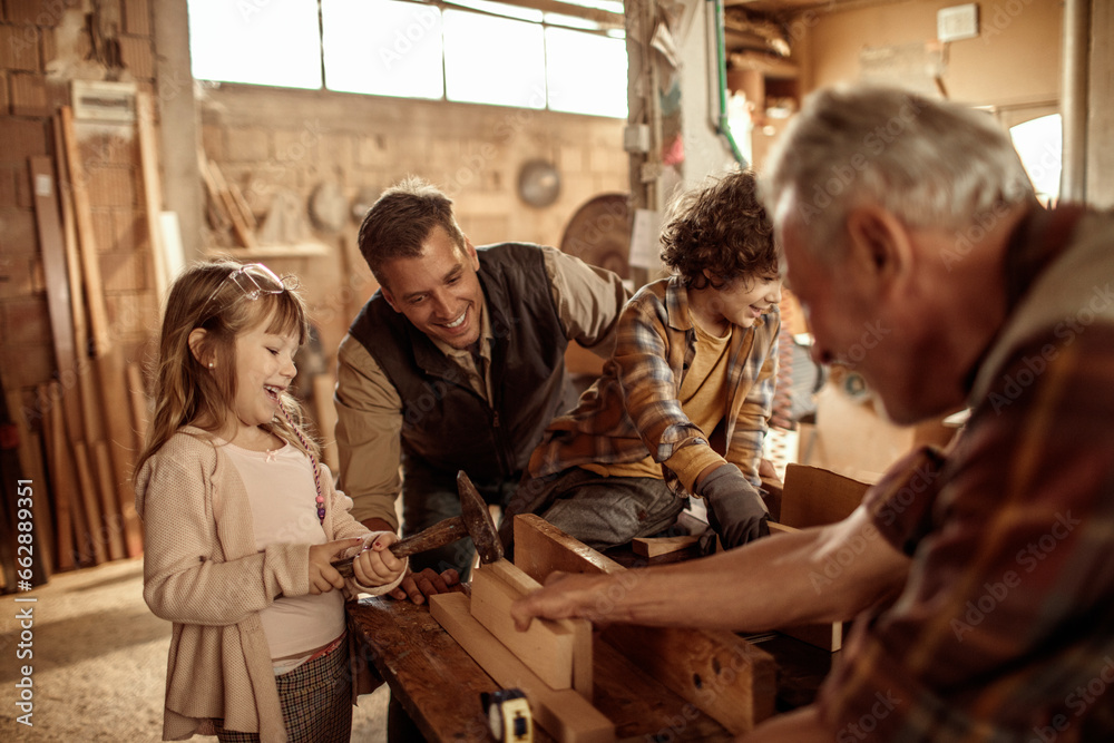 Obraz premium Young future carpenters learning the ways of their elders in a wood shop