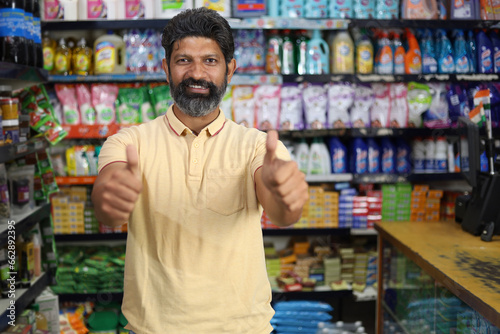Wallpaper Mural Beautiful portrait of handsome and smiling bearded man shopping and posing in hypermarket. Local mini mall happy smiles of satisfied customer. Torontodigital.ca