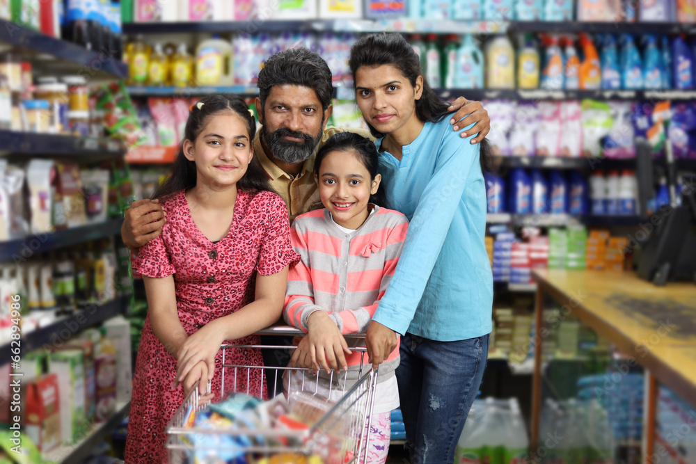happy family shopping in grocery store and supermarket. They are looking for desired products they need to purchase.