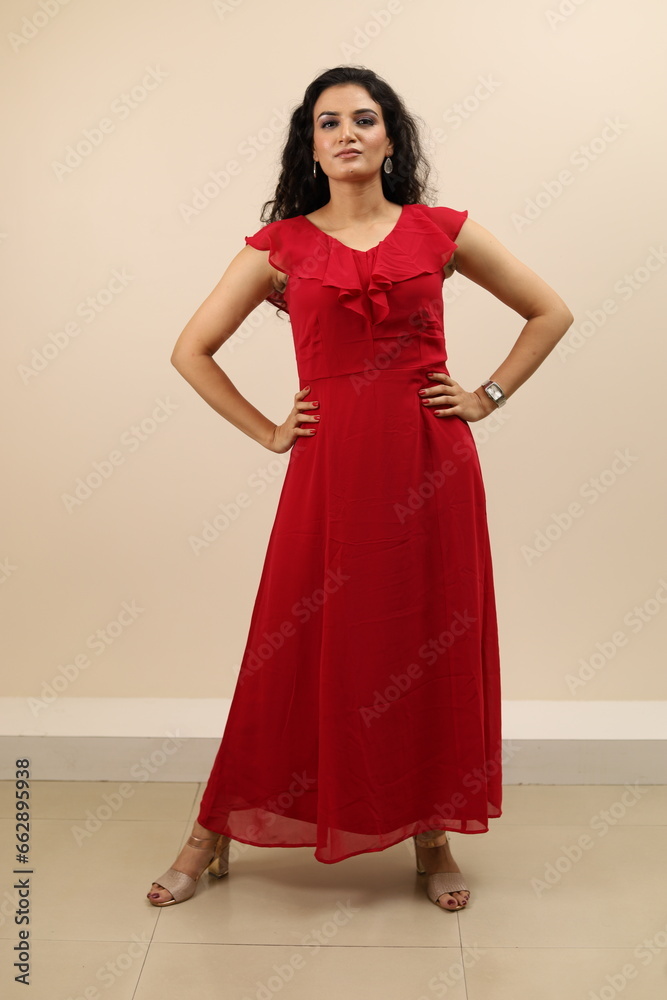 Lady flaunting. Beautiful portrait of a confident, sexy young lady in red gown flaunting and wearing eyewear. Lady flaunting. Beautiful portrait of a confident, sexy young lady in red gown flaunting and wearing eyewear.