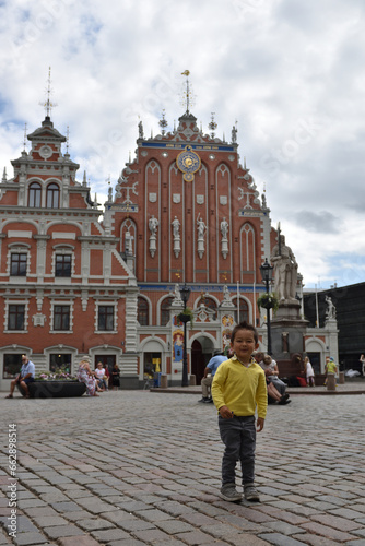 Kid playing traveling in Riga, letonia
