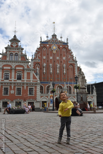 Kid playing traveling in Riga, letonia
