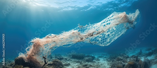 Discarded fishing net left on coral reef With copyspace for text