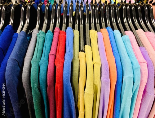 Colorful clothed on hangers closeup