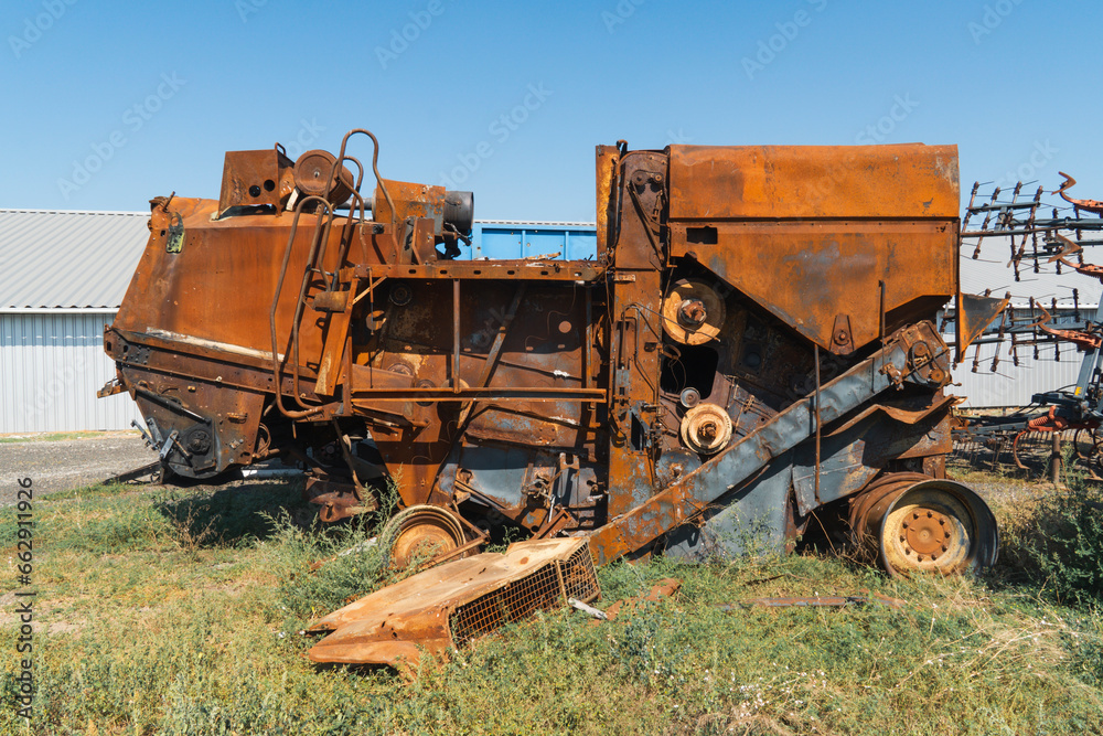 Damaged agricultural equipment destroyed by artillery fire. War in Ukraine