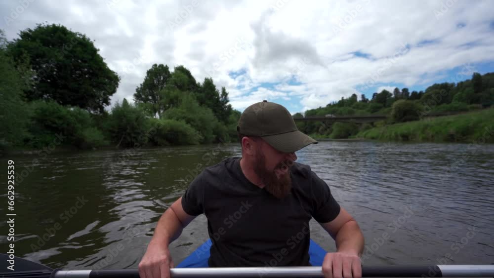 A man paddling a kayak on a river while talking to himself A man paddling a kayak on a river while talking to himself
