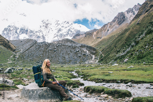  happy woman with touristic rucksack enjoying travel adventure