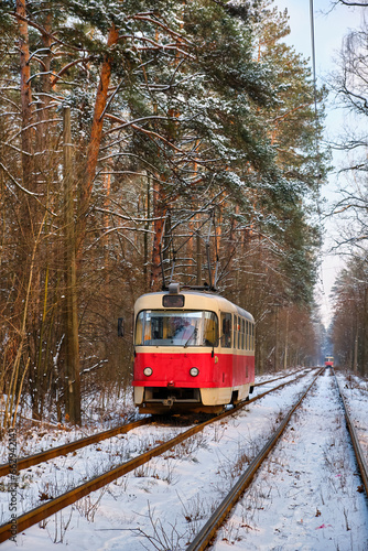 Winter Journey Through the Forest by Red Tram