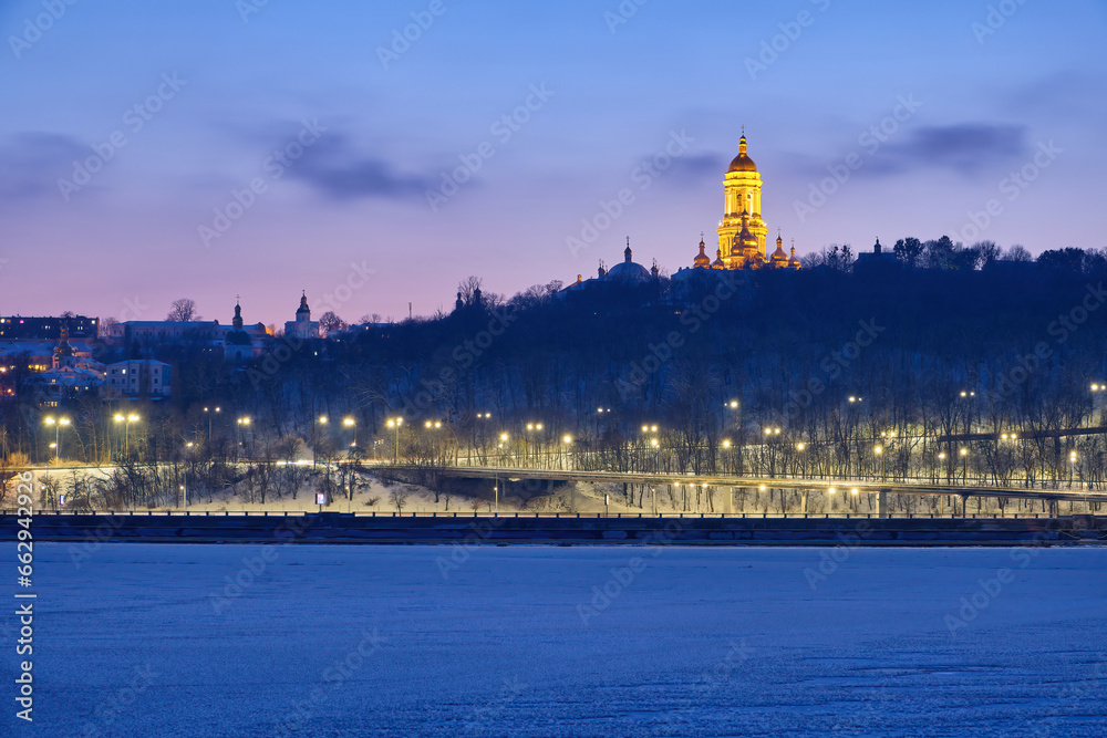 Fototapeta premium Winter's Dusk Over Dnipro River and Kyiv