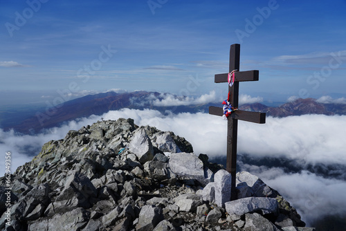Fototapeta Naklejka Na Ścianę i Meble -  Kriváň (Krywan) - national sacred mountain of Slovaks, 2495 metres. Located in Tatras (Tatry) mountains. Photo taken during sunny day and amazing clouds, fog 