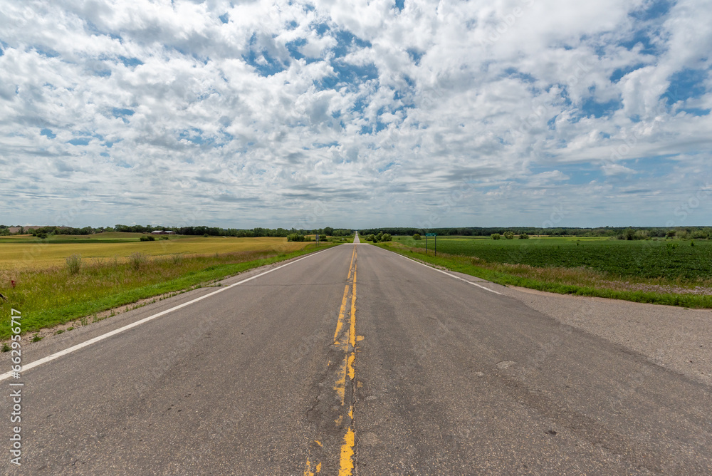 Looking down the center line of a country road in rural Minnesota, USA.
Looking down the center line of a country road in rural Minnesota, USA.