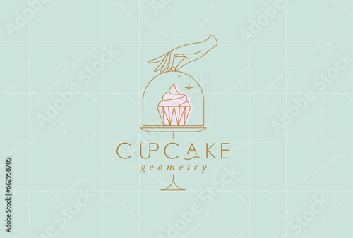 Obraz na płótnie Cake stand with cupcake in art deco style holding by hand drawing on turquoise background w salonie