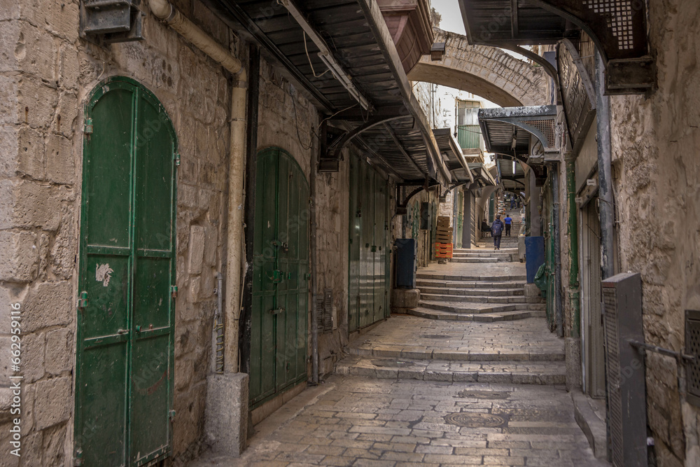 The empty streets and the stone stairs of the historic old city of Jerusalem in Israel. The empty streets and the stone stairs of the historic old city of Jerusalem in Israel.