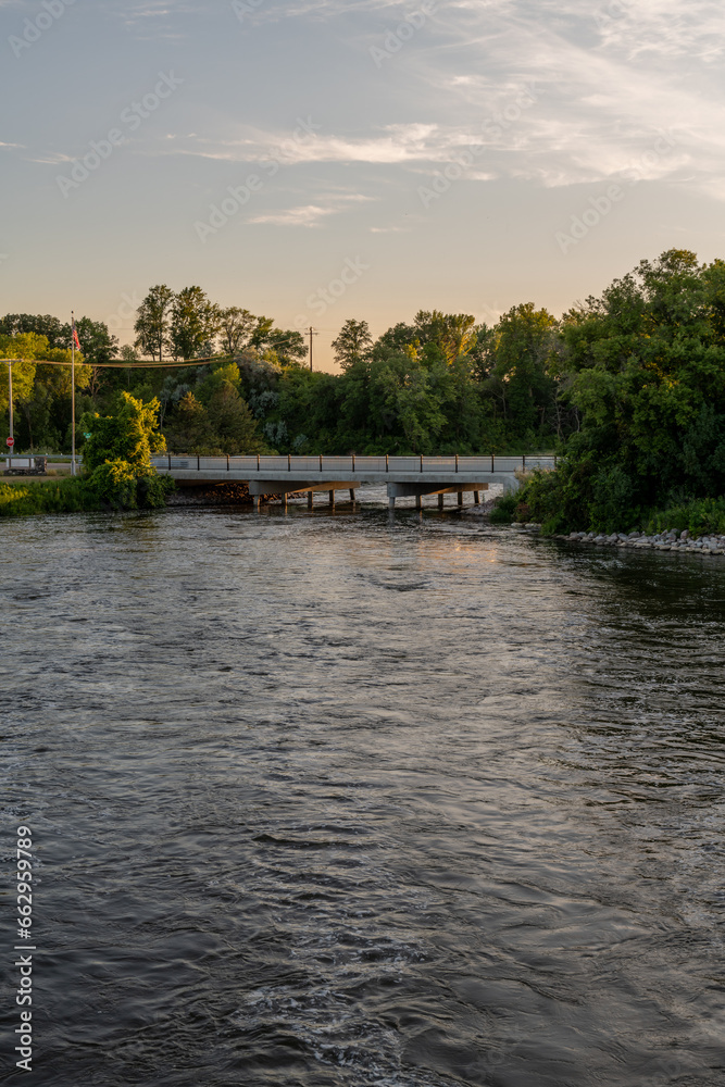 Naklejka premium Bridge over the Otter Tail River in the Summertime in rural Minnesota, United States. 