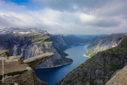 trolltunga rock and fjord in the background photo
