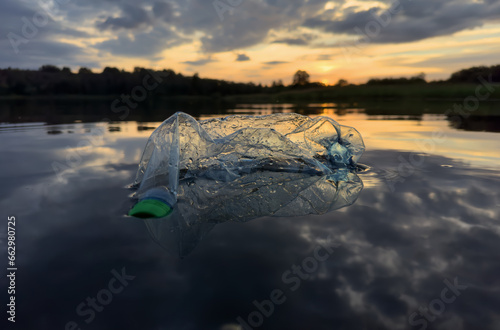 Marine plastic pollution from human activities at coastlines. Plastic waste in lake. Microplastics in groundwater. Ocean pollution and marine debris. Litter such as plastic from food in water of river