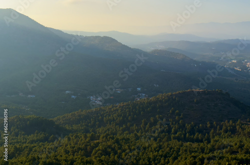 Mountains landscape, nature scenery. Sunset over mountain rock. View from Peak of La Redona mountain range in Sierra Calderona, Spain. Landscape of a mountain valley.