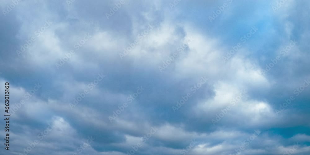 Clouds flowing on blue sky. Summer beautiful outdoor cloudy sky. Clouds flowing on blue sky. Summer beautiful outdoor cloudy sky.