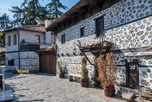 Typical street and buildings at old town of Bansko, Bulgaria photo